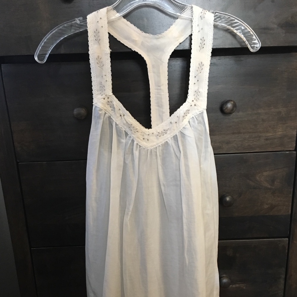 White flowy dress with intricate design
